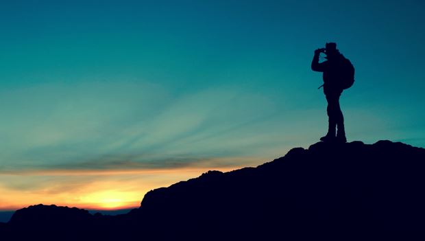Image of a person watching sunset on a mountain