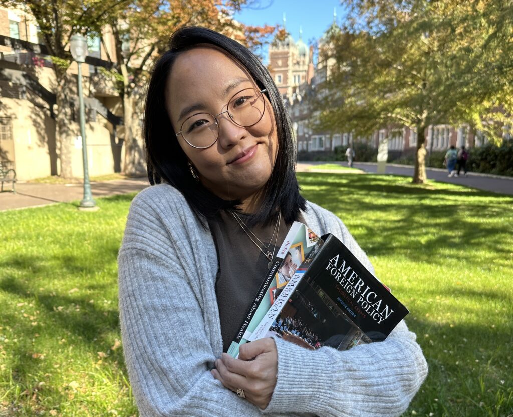 Ayoung Lee, learning specialist, holding two books