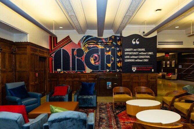 Photo of ARCH Cafe Lobby with comfortable seating and a mural on the wall